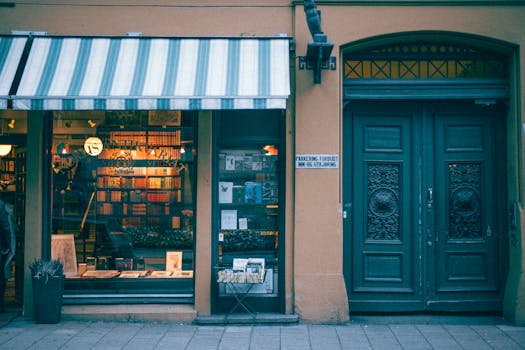 Cozy bookstore entrance with classic design and decorative storefront on a city street.